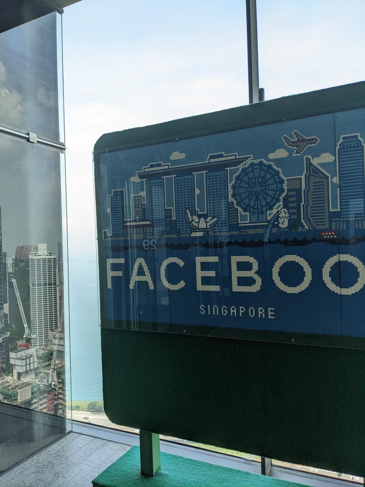 The Facebook Singapore sign against the Marina Bay skyline, from Meta's Singapore office during Ammar Ahamed's visit
