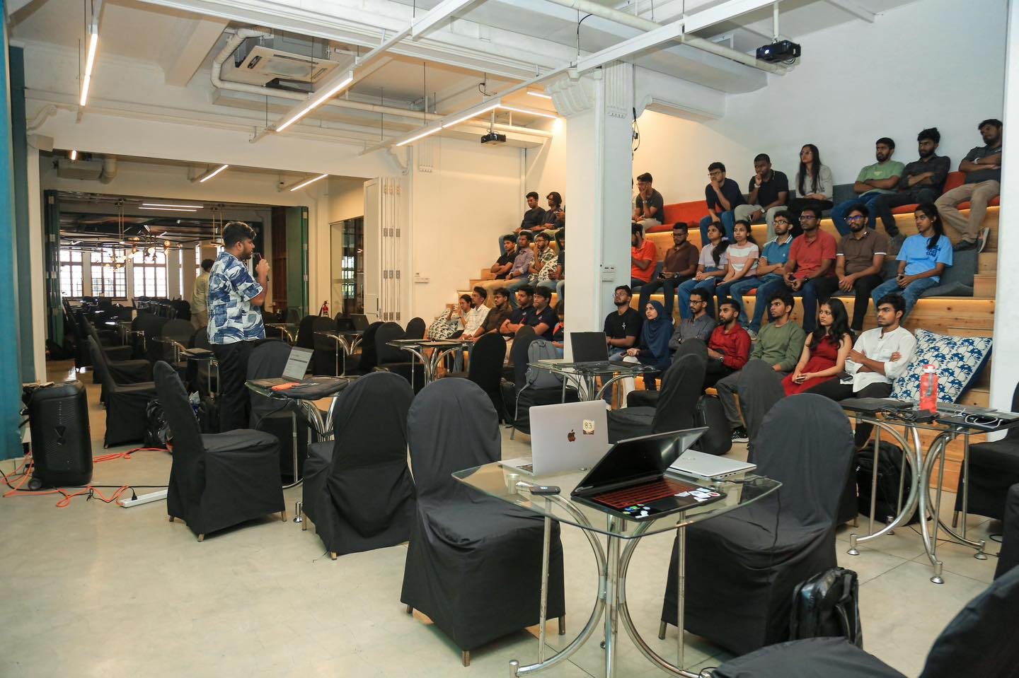 Teams building at the Generative AI Hackathon workspace in Colombo, judged by Ammar Ahamed
