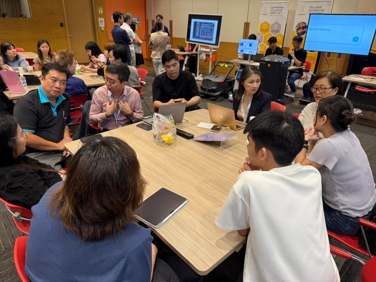 Business owners working through their AI use cases at the SAIA AI Clinic in Singapore, which Ammar Ahamed attended for Vector Agents