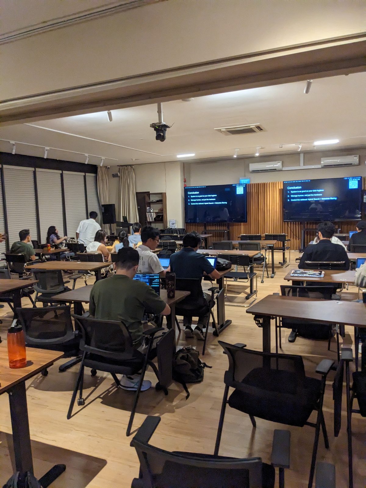 A Singapore coworking floor at work, on Ammar Ahamed's April 2026 trip